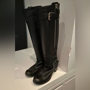 Miu Miu black leather tall moto boots with big silver zippers.